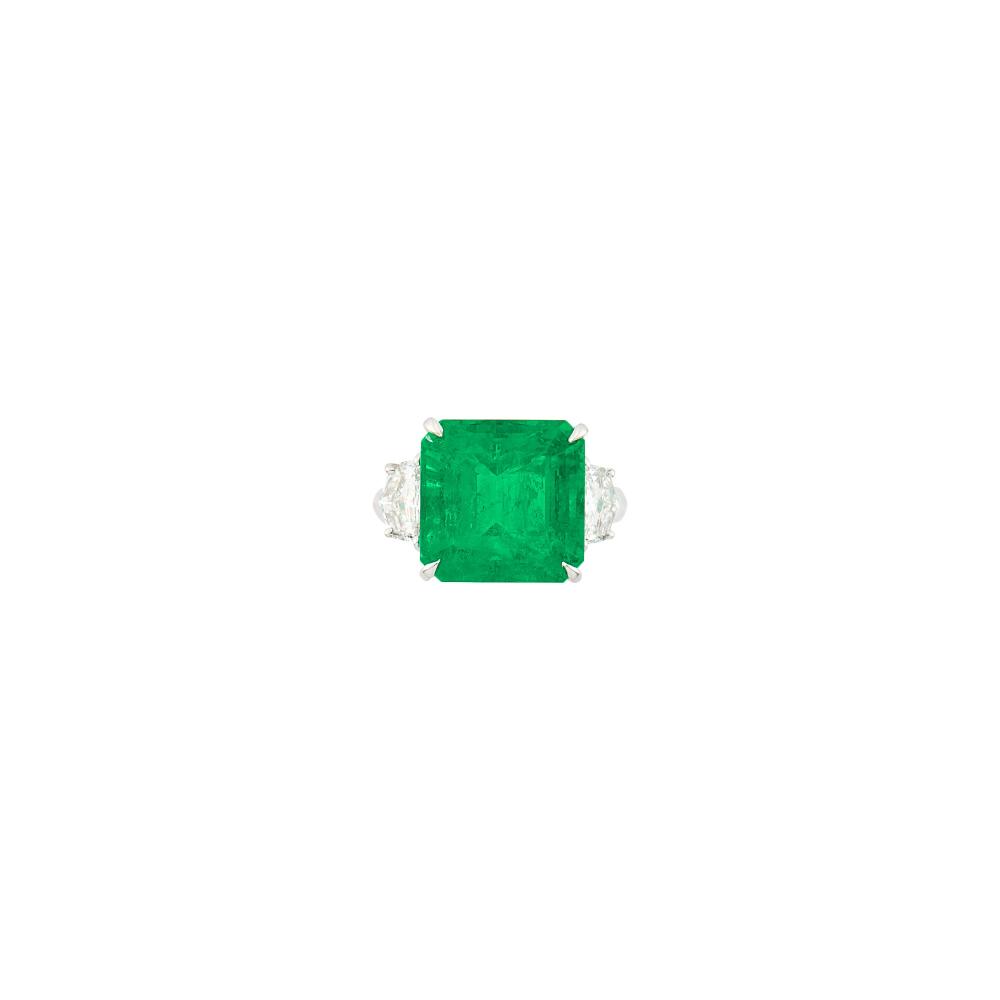 Property of a California Jewelry ConnoisseurOne square emerald-cut emerald weighing 9.67 cts., 2 fancy-shaped diamonds ap. .90 ct. Size 5 3/4.
 
With AGL report no. 1151356 stating Colombian origin, with Minor, Mixed-Type clarity enhancement.

Emerald: bright medium deep faintly bluish-green, good color concentration, moderately included, slightly visible, lively.Diamonds: H-I-VS.Width 1/2inch.                            
Any condition statement is given as a courtesy to a client, is an opinion and should not be treated as a statement of fact and our Organization shall have no responsibility for any error or omission. Please contact the specialist department to request further information or additional images that may be available.