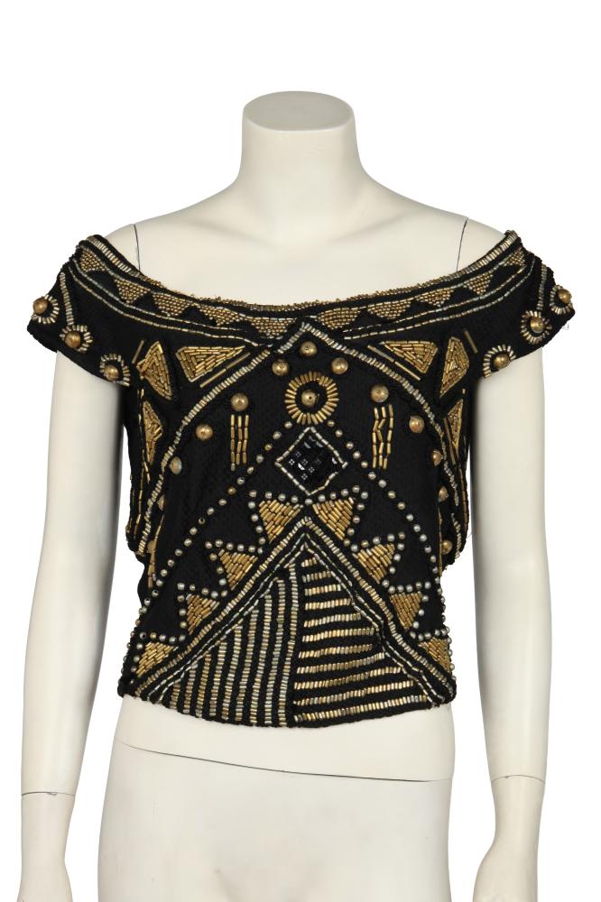 A Gianni Versace embroidered black silk bodice, Spring-Summer 1990

A Gianni Versace embroidered black silk bodice, Spring-Summer 1990

Couture label, size 44, of brick-stitch-effect woven silk threads, embellished with black cord, sequins, brass tubes, beads and discs, with off-the-shoulder neckline, zip closure to side, bust 97cm 38in

Share this lot:
