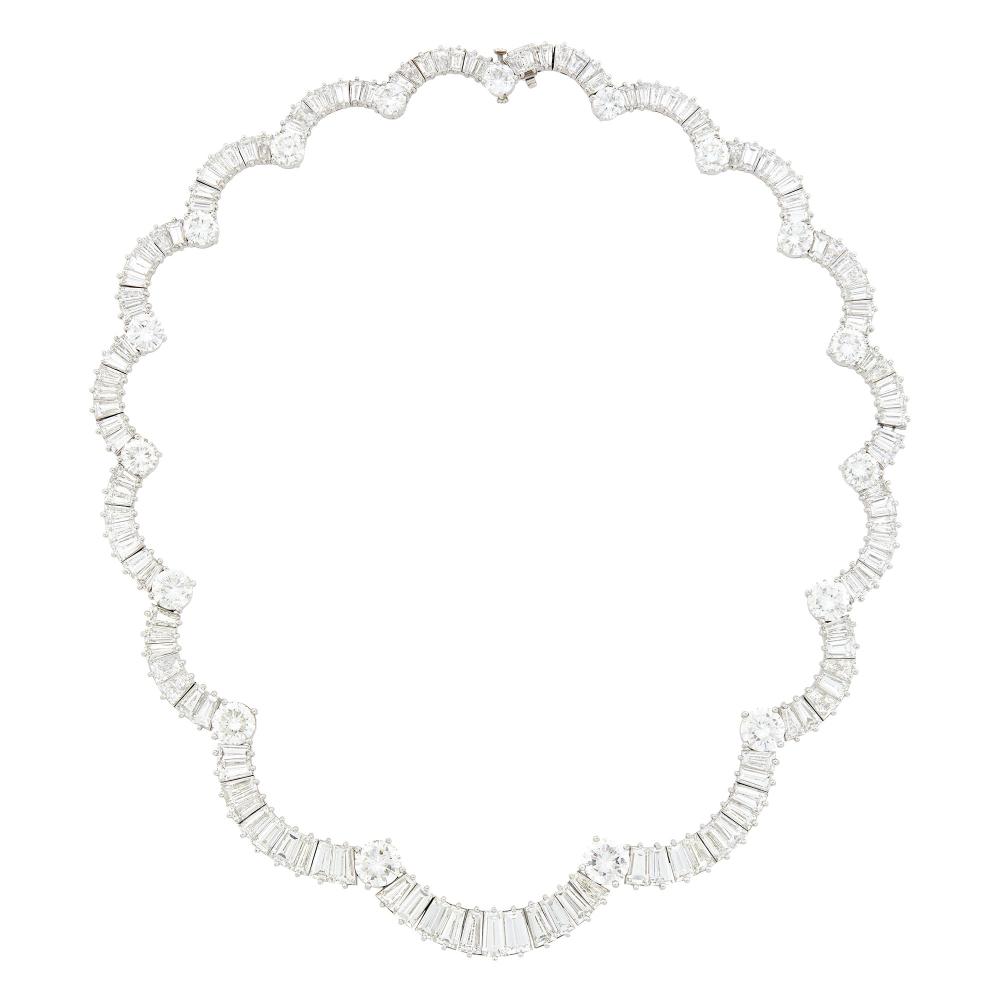 Collection of a Palm Beach Philanthropist17 round diamonds ap. 14.75 cts., 129 tapered baguette diamonds ap. 36.75 cts., signed Van Cleef & Arpels, no. 47470, no. 7523 on safety clasp, with extension, 2 round diamonds ap. .95 ct., 14 tapered baguette diamonds ap. 1.70 cts., altogether ap. 55.8 dwts. Lengths 15 and 16 1/2 inches.
 
Please note that one link is stretched and will be repaired by Doyle.

Diamonds: F-G-VS.Width 3/8 to 3/16 inch.                            
Any condition statement is given as a courtesy to a client, is an opinion and should not be treated as a statement of fact and our Organization shall have no responsibility for any error or omission. Please contact the specialist department to request further information or additional images that may be available.