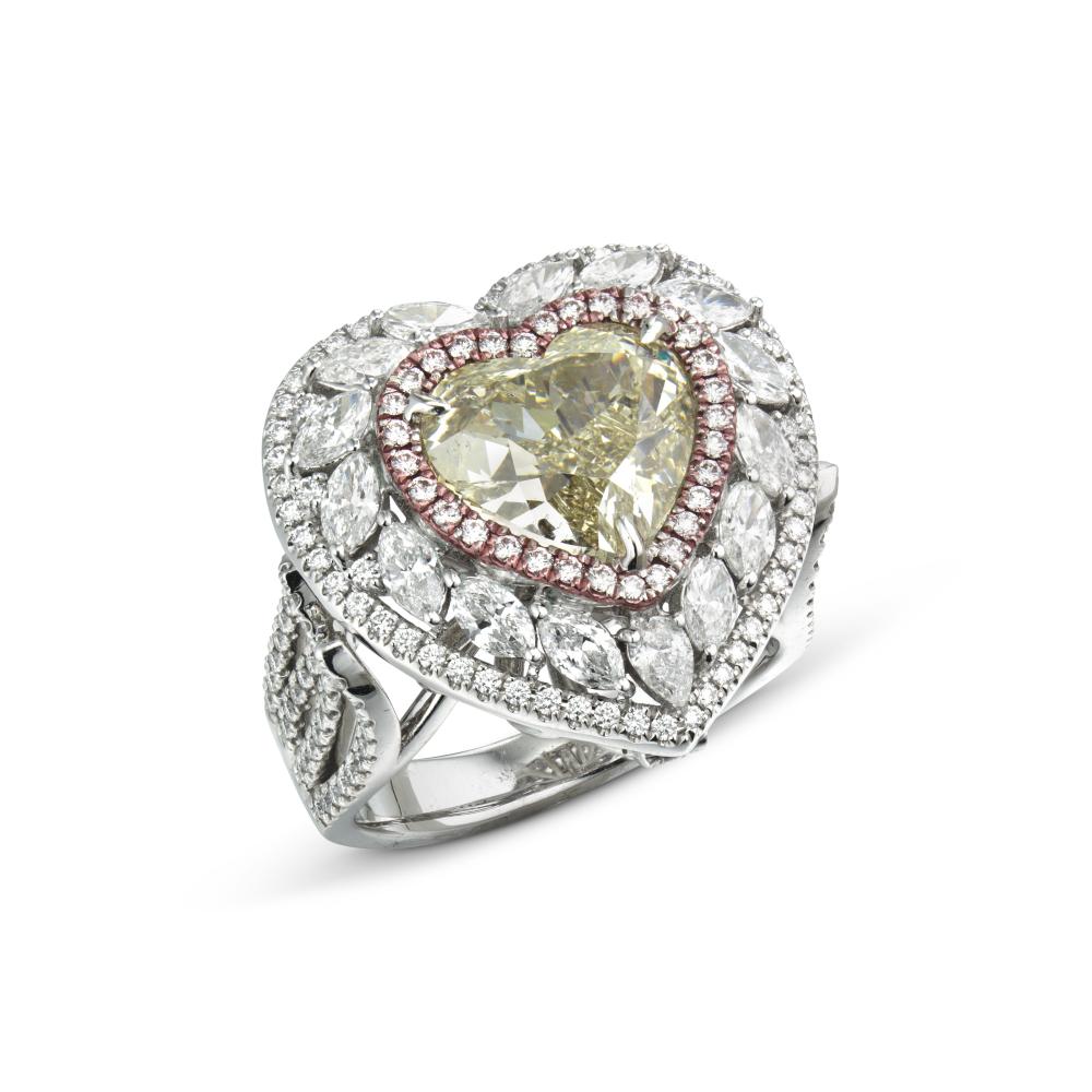 COLOURED DIAMOND AND DIAMOND RING

Fancy light brown-greenish yellow heart modified brilliant-cut diamond of 5.02 carats, pear, marquise-cut and round diamonds, gold 
GIA, 2025, report no. 2235227112: 5.02 carats, Fancy Light Brown-Greenish Yellow colour, SI2 clarity, excellent polish and symmetry 
Size/Dimensions: US ring size 7 ¹⁄₄ 
Gross weight: 14.1 grams