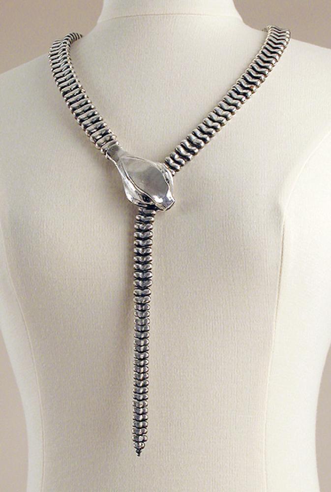 Elsa Peretti Sterling Silver Snake Belt

Lot 922
Elsa Peretti Sterling Silver Snake Belt
 American, 1973 
 Of solid silver graduated articulated links, the snake head with black cabochon eyes, the tail inserted through jaws to form belt or lariat. 
 See John Loring,, Tiffany Fauna, p.93 for gold version.