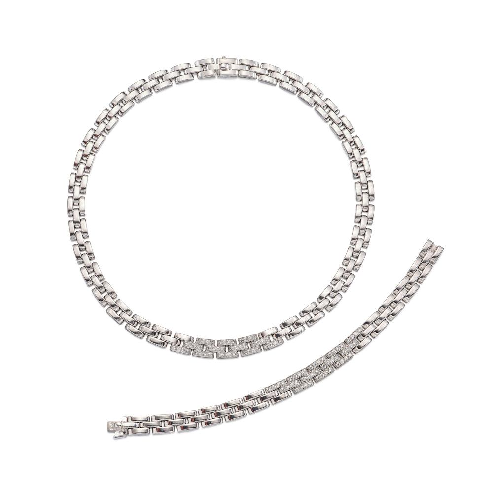 Cartier

Necklace composed of three rows of articulated brick linking, decorated with brilliant-cut diamonds, bracelet of similar design, decorated with brilliant-cut diamonds.