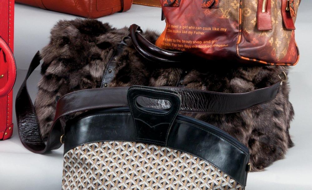 GERCAULT

Sac de voyage 55cm en patchwork de Renard lustré et cuir marron, fermeture éclair, double poignée, anse bandoulière. Très bon état