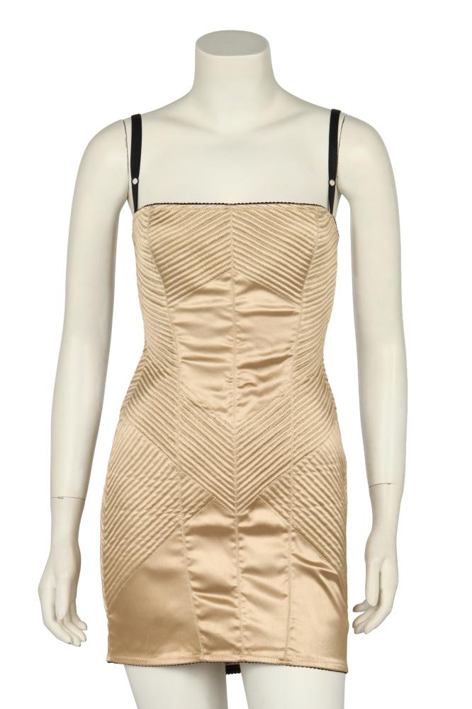 A Dolce & Gabbana champagne satin bodycon dress, early 2000s

A Dolce & Gabbana champagne satin bodycon dress, early 2000s

labelled, size 42, with decorative zigzag top stitching, elasticated neckline and hem, adjustable straps, bust 81-86cm 32-34in

Share this lot: