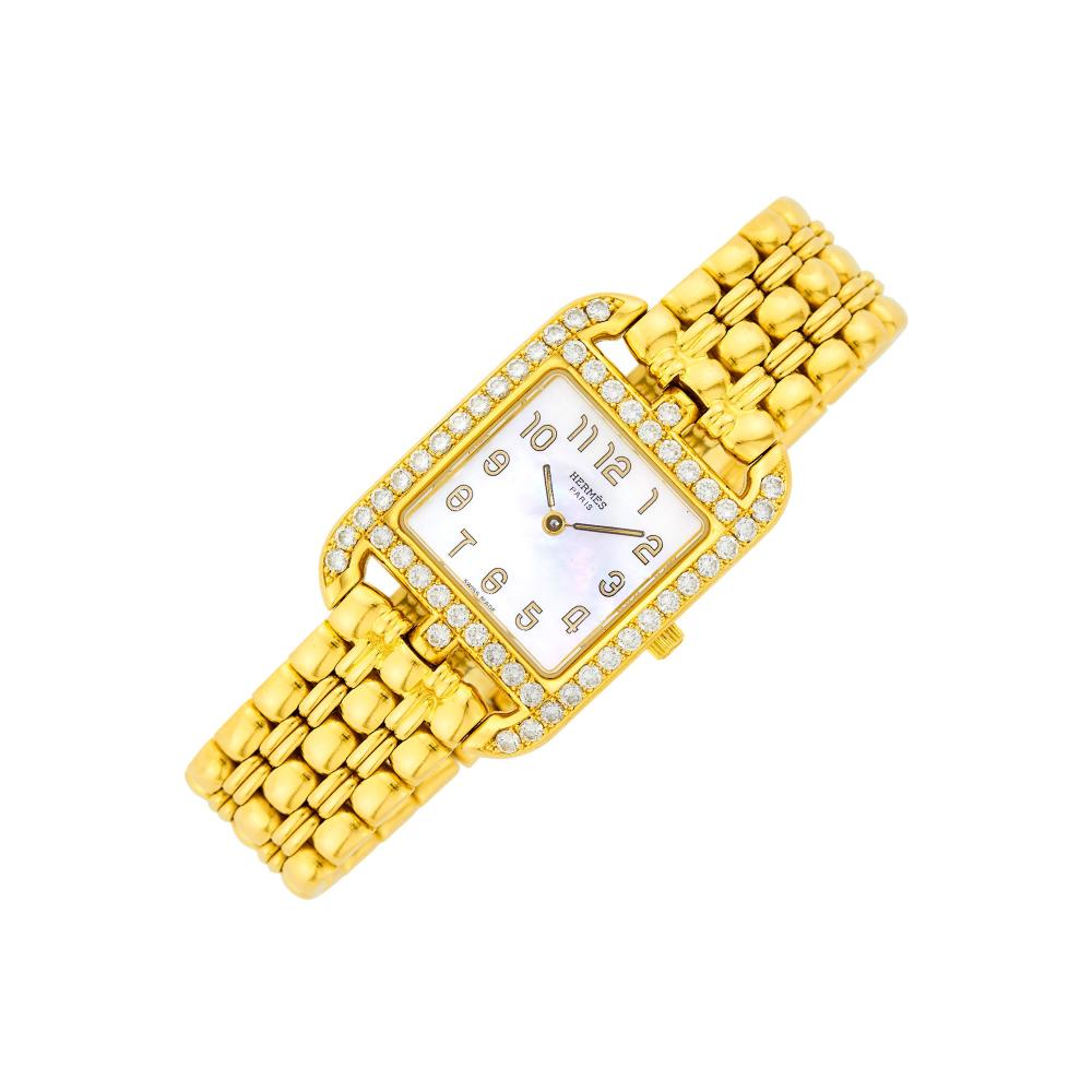 The Martin and Lynn Halbfinger Collection18 kt., quartz, square mother-of-pearl dial, painted gold-tone Arabic numerals outlined in black, diamond-set case and lugs of 50 round diamonds ap. 1.50 cts., case diameter ap. 33.5 x 23 mm., five-row bar link bracelet with double deployant clasp, signed Hermès, case nos. 930774, CC1.289, ap. 55 dwts. gross. Length 5 3/4 inches.

The movement is currently running, but not guaranteed to be in working order.Diamonds: G-H-I-VS.Small chip at edge of crystal by 10:00.Case diameter 1 3/16 x 15/16 inches. Bracelet width 9/16 inch.                            
Any condition statement is given as a courtesy to a client, is an opinion and should not be treated as a statement of fact and our Organization shall have no responsibility for any error or omission. Please contact the specialist department to request further information or additional images that may be available.
