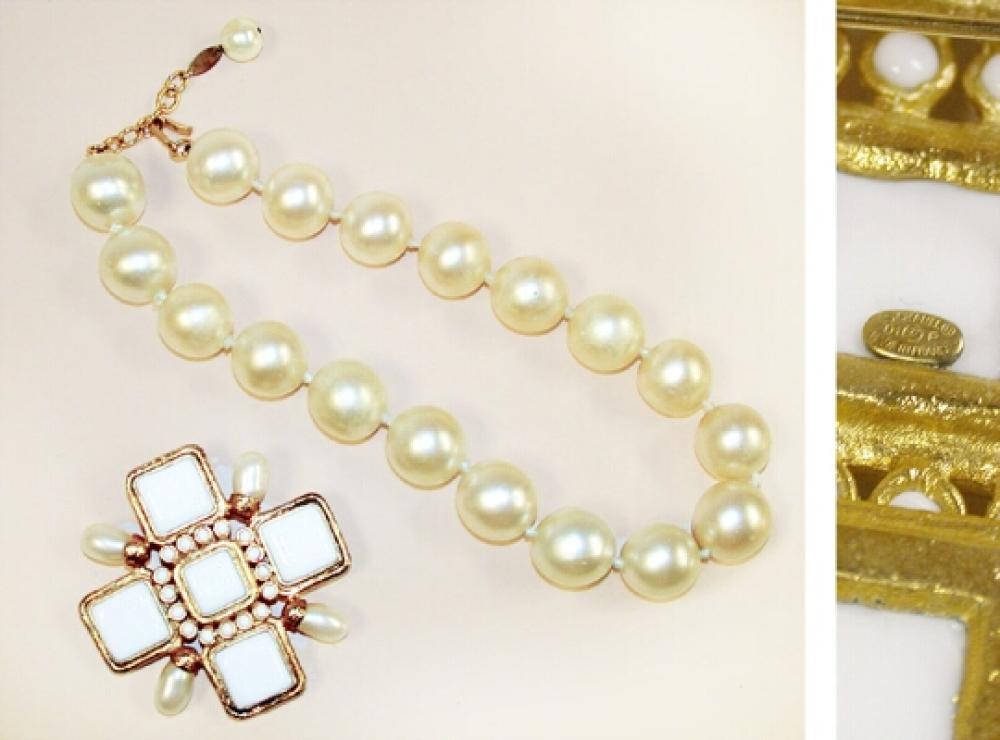 Two Chanel Costume Jewelry Pieces

Lot 943
Two Chanel Costume Jewelry Pieces
 French 1980s 
 Comprising a knotted faux South Seas pearl choker and a gilt-metal Maltese cross brooch set, with white enamel and faux baroque pearls, both marked: Chanel. 
Very good condition, pearls having minor scratches.