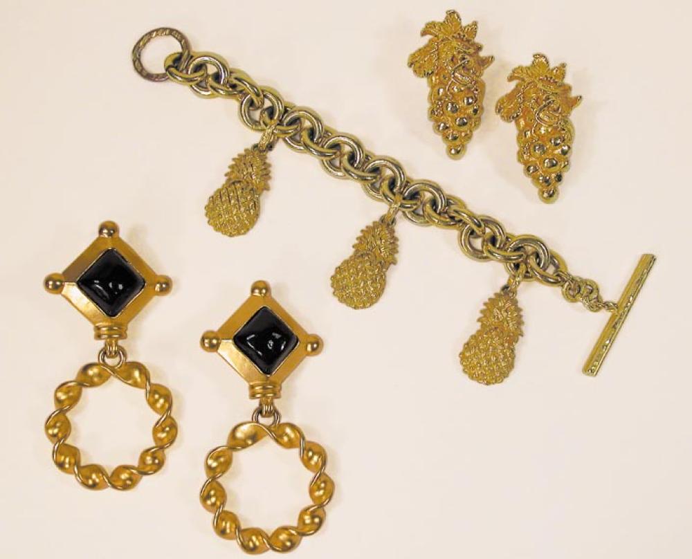 Group of Gold Washed Jewelry

Lot 947
Group of Gold Washed Jewelry
 French, 1980s 
 Comprising a linked bracelet with three pineapple charms, pair of earclips in the form of a bunch of grapes, both marked: Dominique Aurientis/Paris; and a pair of Karl Lagerfeld drop earrings, of lozenge shape black glass in gold frames with twisted wire pendants, marked: KL. 
Excellent condition.