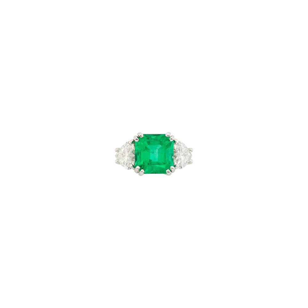 Property of a Prominent Collector18 kt., one cut-cornered square step-cut emerald weighing 4.25 cts., 2 heart-shaped diamonds ap. 1.50 cts., ap. 4.7 dwts. Size 4.
With AGL report no. 1154128 stating Colombian origin, with gemological evidence of Minor Modern clarity enhancement.

Emerald: very bright medium green, moderately included, minor surface-reaching inclusion on step facet, nice shape and cut, lively.Diamonds: G-H-I-VS-SI.                            
Any condition statement is given as a courtesy to a client, is an opinion and should not be treated as a statement of fact and our Organization shall have no responsibility for any error or omission. Please contact the specialist department to request further information or additional images that may be available.