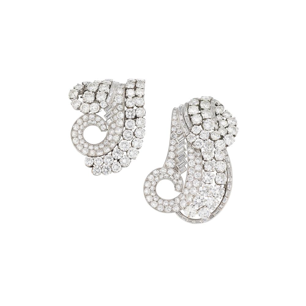 LE ROY ET FILS ART DÉCO DIAMOND CLIP BROOCHES

Circular- and baguette-cut diamonds, circa 1935, signed Le Roy et Fils, numbered, original frame to wear as a double clip brooch deficient 
Size/Dimensions: 5.4 x 3.6 cm and 4.2 x 3.1 cm 
Gross Weight: 44.8 grams