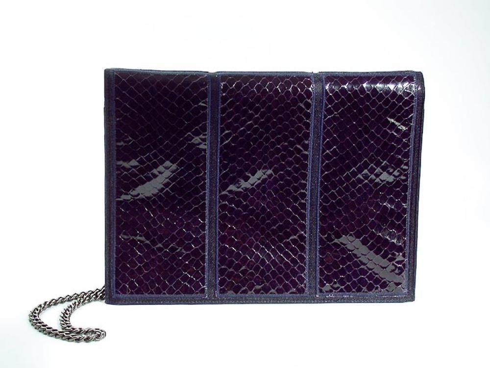 Chanel Purple Lizard Clutch

Lot 879
Chanel Purple Lizard Clutch
 Of rectangular shape with flap, three vertical panels of lizard on each surface, optional gunmetal shoulder chain, 9 x 7 inches, labeled: Chanel. 
Excellent condition, never used, in original box.
