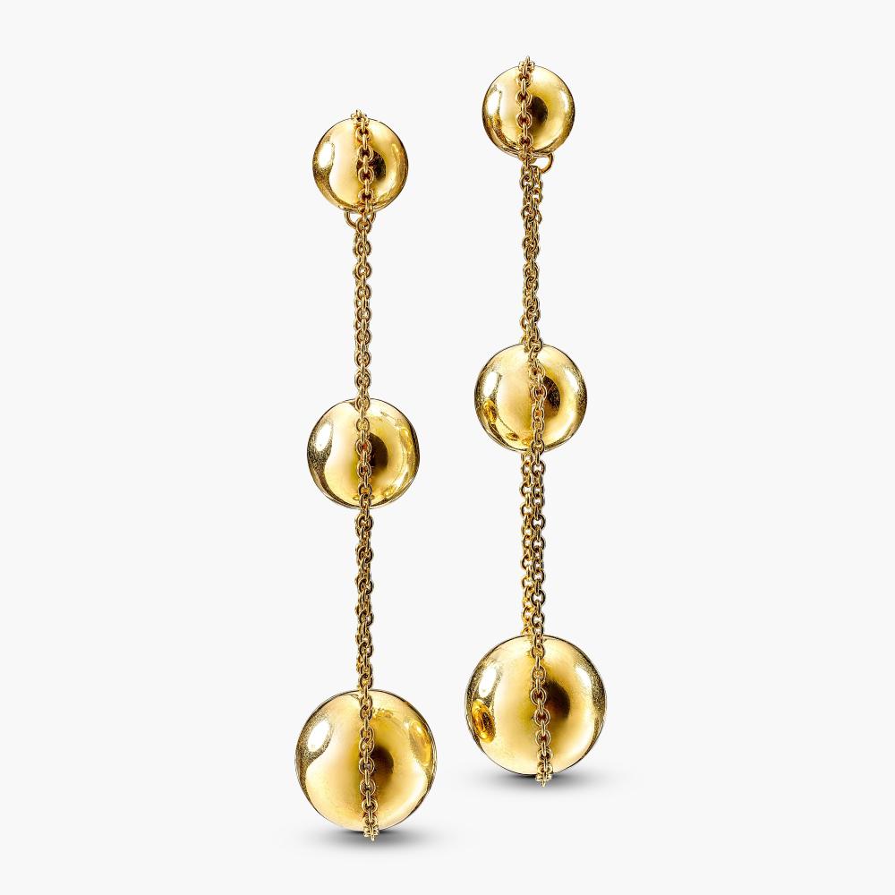Tiffany & Co.

Each suspending a graduated line of gold boules, connected by a fine gold chain.