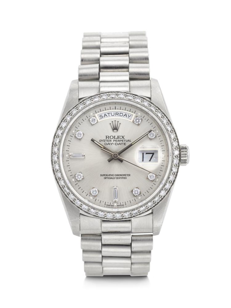 ROLEX, OPULENT AND HEAVY PLATINUM AND DIAMOND-SET ‘DAY-DATE’, REF. 18346

CIRCA: 1989 
CASE NO: L782920 
CASE MATERIAL: Platinum 
CASE DIAMETER: 36 mm. 
BRACELET MATERIAL: Platinum 
BRACELET SIZE: Approx. 185 mm. overall length 
DIAL: Silvered with diamond indexes 
MOVEMENT: Automatic 
FUNCTIONS: Day, date 
BOX: No 
PAPERS: No  
WITH: Rolex Service Guarantee dated 2005