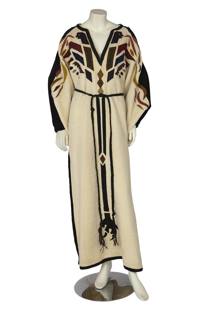 A Bill Gibb for Baccarat cream bouclé tunic/dress, circa 1970

A Bill Gibb for Baccarat cream bouclé tunic/dress, circa 1970

Baccarat labelled, the cream wool bouclé appliquéd with multicoloured suede and leather Native American-inspired geometric forms, the long rectangular sleeves trimmed with black suede, with narrow cuffs, high leather-trimmed slits to skirt sides, braided leather cord belt, bust approx 97cm 38in

Share this lot: