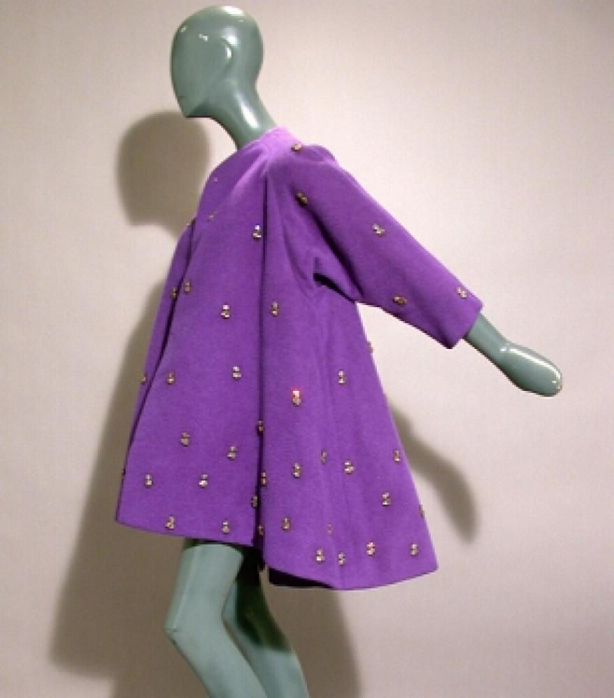Trigere Purple Swing Jacket

Lot 529
Trigere Purple Swing Jacket
 1950s 
 The purple wool jacket with large gray crystal rhinestones throughout, with three-quarter length sleeves, hemline slightly dips front to back, size 8, labeled: Trigere/ New York.
Good condition.