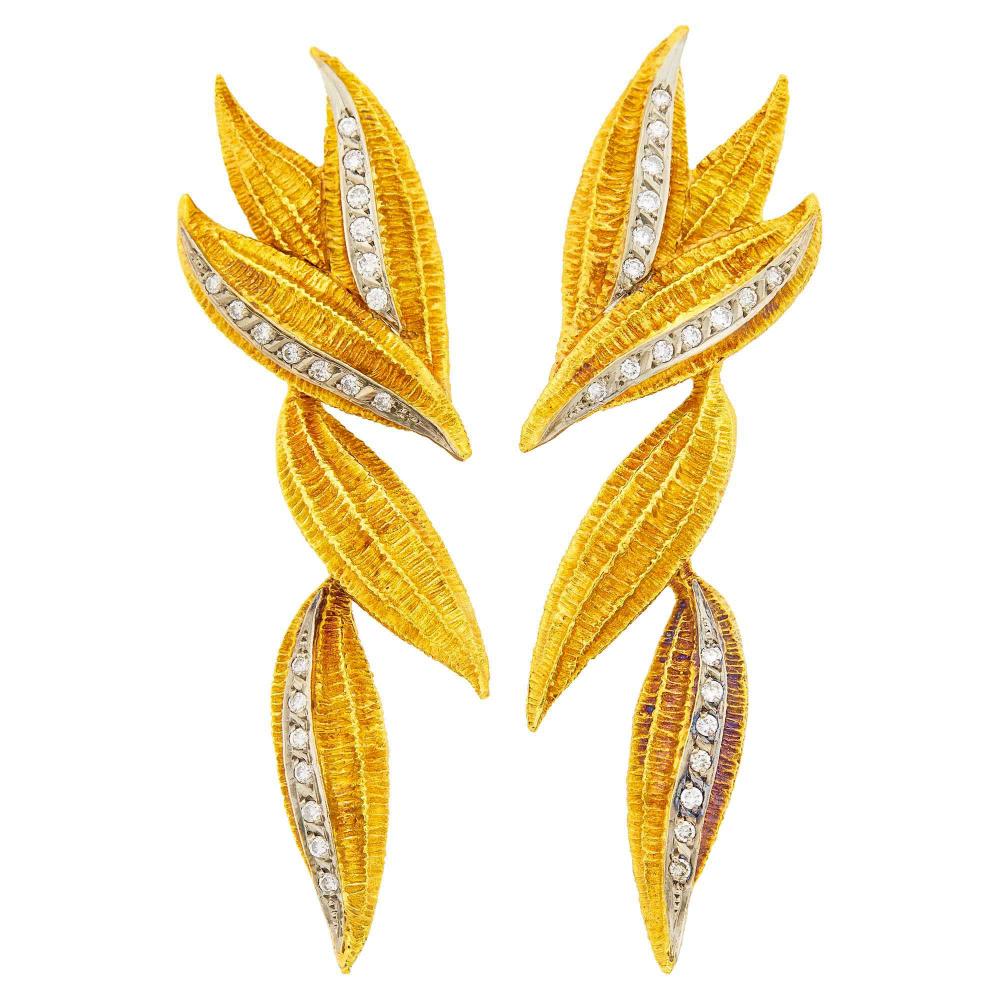 Property of a Distinguished Lady from Athens, Greece18 kt. yellow and white gold, 42 round diamonds ap. 1.20 cts., signed Mapamenos Natepas, ap. 25.3 dwts.

Diamonds: I-J-VS.Minor rosy patina in some areas.Clip-backs. 3 1/4 x 7/8 inches.                            
Any condition statement is given as a courtesy to a client, is an opinion and should not be treated as a statement of fact and our Organization shall have no responsibility for any error or omission. Please contact the specialist department to request further information or additional images that may be available.