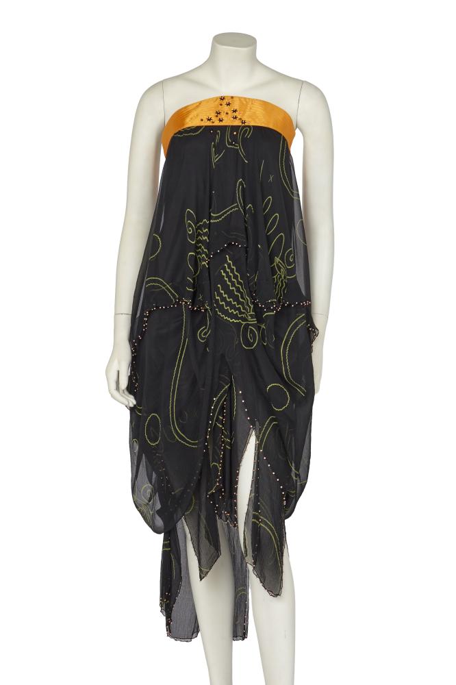 A Zandra Rhodes cocktail dress with ’`Magic Head’ motifs, Autumn-Winter 1978-79

A Zandra Rhodes cocktail dress with ’`Magic Head’ motifs, Autumn-Winter 1978-79

labelled, the strapless bodice with curved yellow satin top-stitched band adorned with starshaped beads and sequins, layered black chiffon with green ’Magic Heads’ print, the tiers edged in metallic pink beads, bust approx 81cm 32in

Share this lot: