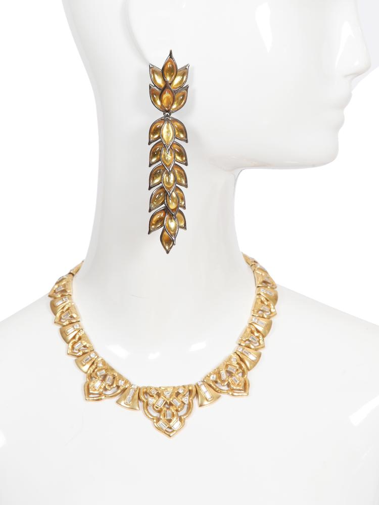An Yves Saint Laurent gilt and rhinestone necklace and earrings, late 1970s-80s

An Yves Saint Laurent gilt and rhinestone necklace and earrings, late 1970s-80s

stamped to clasp and safety chain, the necklace formed of articulated Art-Deco inspired links set with baguette-cut rhinestones, length approx 36cm 14in; the ear-clips, likely by Robert Goossens, each formed of gilt wheat ears set with yellow glass kernals, stamped, length 13cm 5in (3)

Share this lot: