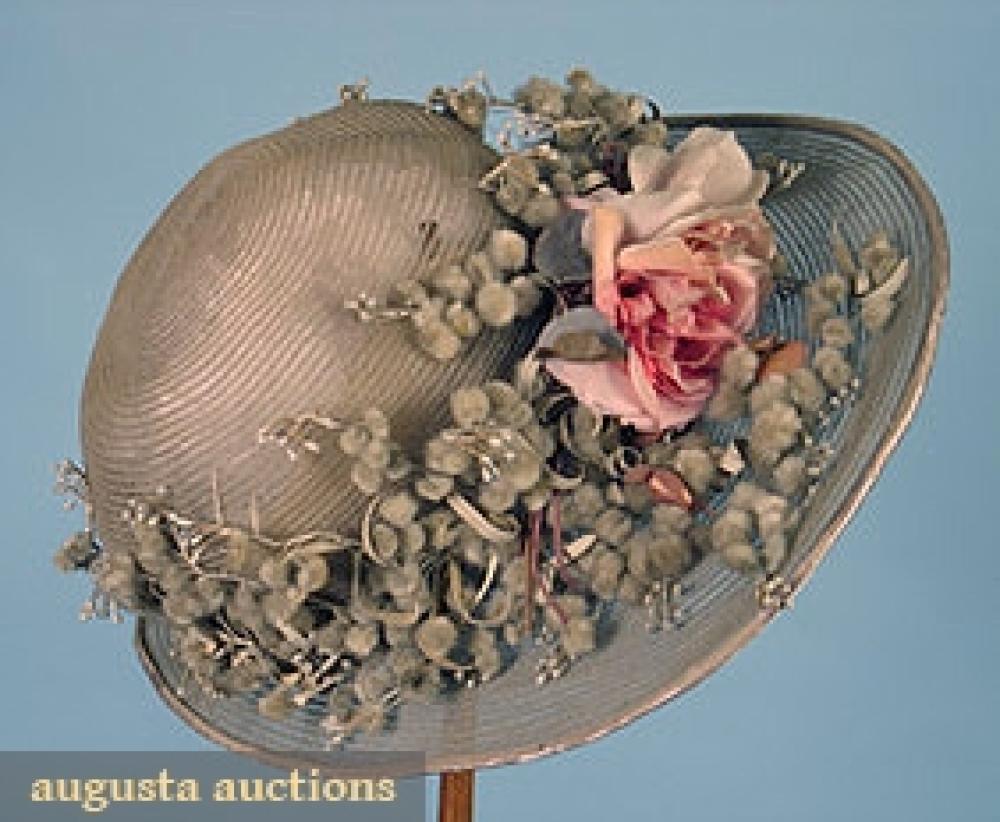WIDE BRIM PARIS CLOCHE, 1920s

Pale grey horsehair w/ grey pussy willow & pink rose decoration, Caroline Reboux Paris label, (lining damaged, silk brim edge slight fraying) good.		
Bid Online
Price Realized: $287.50Category:HatsEra:1920-1949
11.7529.631.456