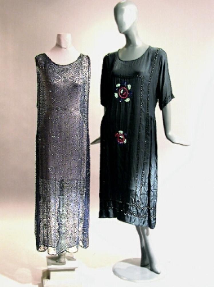 Two Vintage Dresses

Lot 505
Two Vintage Dresses
 1920s 
 The first, a navy sheath of sheer chiffon beaded throughout; the second, a black satin drop waist with black bugle bead trim and abstract multicolored flower in the center of the front and back. 
Each good condition.