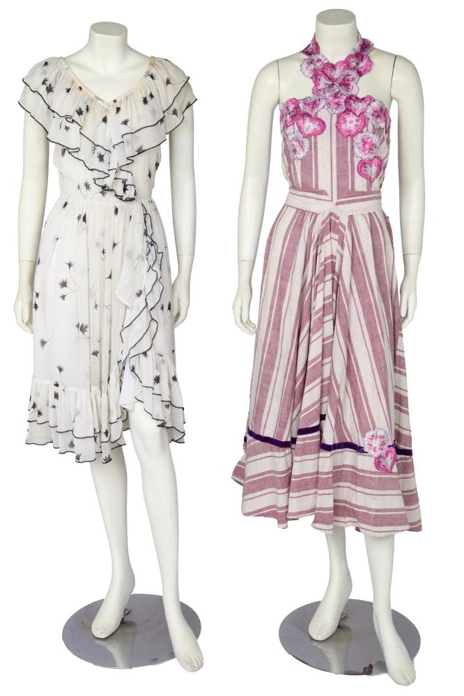 Two Thea Porter summer dresses, 1970s

Two Thea Porter summer dresses, 1970s

comprising: a mauve and white Madras striped cotton halterneck dress, the bodice appliquéd with embroidered flowerheads and hearts with ties to waist, purple velvet ribbon to hem flounce, Couture labelled, bust approx 81cm 32in; the other of white chiffon printed with black leaf sprigs, V-neckline edged in flounces, and with ruffle to front of skirt and hem, bust approx 86cm 34in (2)

Provenance: the late Lola Yearwood collection

Share this lot: