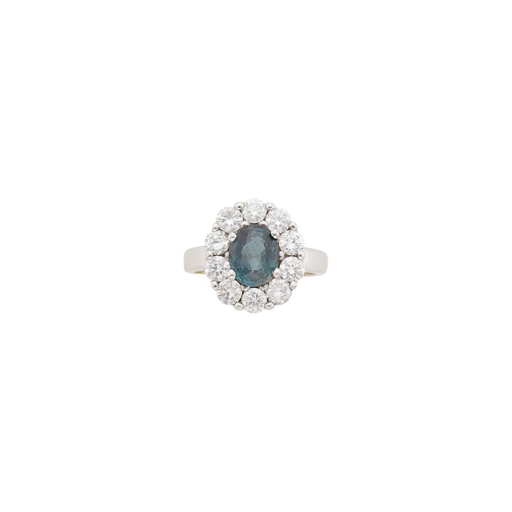 14 kt., one oval alexandrite weighing 3.05 cts., 10 round diamonds ap. 1.50 cts., ap. 4.8 dwts. Size 6, with bumpers.
With AGL report no. 1153899 stating Tanzania origin, with no gemological evidence of enhancement. Color Description: Bluish Green to Brownish Pink. Degree of Color-Change: Strong (70-80%). 
Quality of Color Change: Very Good.

Alexandrite: medium bluish green to brownish pink, cleanish, high crown angles, lively. Diamonds: G-H-VS.Width 5/8 inch.                            
Any condition statement is given as a courtesy to a client, is an opinion and should not be treated as a statement of fact and our Organization shall have no responsibility for any error or omission. Please contact the specialist department to request further information or additional images that may be available.