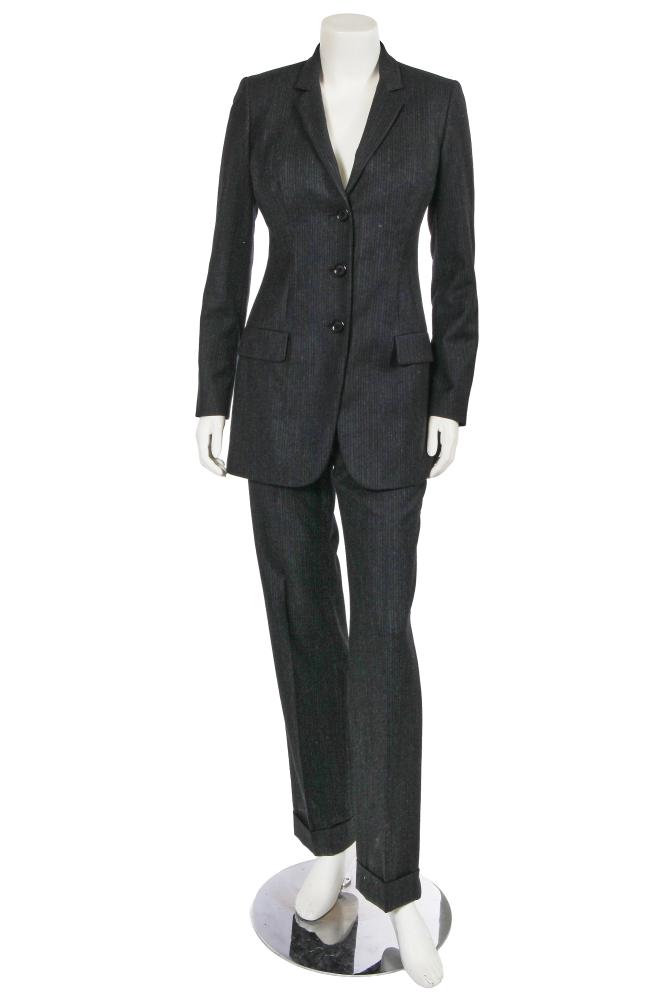 A Dolce & Gabbana grey pinstriped wool suit, late 1990s

A Dolce & Gabbana grey pinstriped wool suit, late 1990s

labelled, size 38, the single-breasted jacket with Dolce & Gabbana black buttons, red monogram lining, bust 86cm 34in; with a pair of matching high-waisted trousers, waist 66cm 26in; together with a Loewe red leather jacket, early 2000s, with curved collar and seams, labelled, bust 91cm 36in (3)

Share this lot: