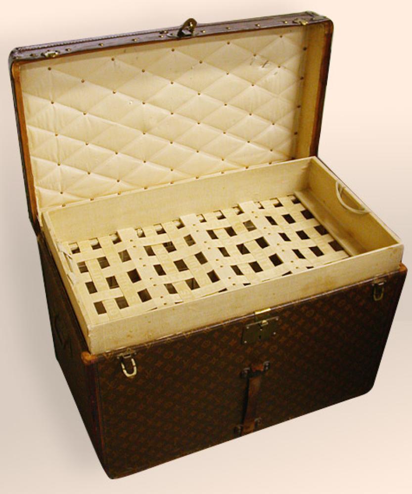 Louis Vuitton Trunk

Lot 1002
Louis Vuitton Trunk
 Monogrammed LV canvas exterior, two canvas straps, mesh interior baskets, 30 x 20 x 17 inches, labeled: Louis Vuitton/1 Rue Scribe/Paris/149 New Bond Street, stamped 141878. 
Good condition, some strap loss.