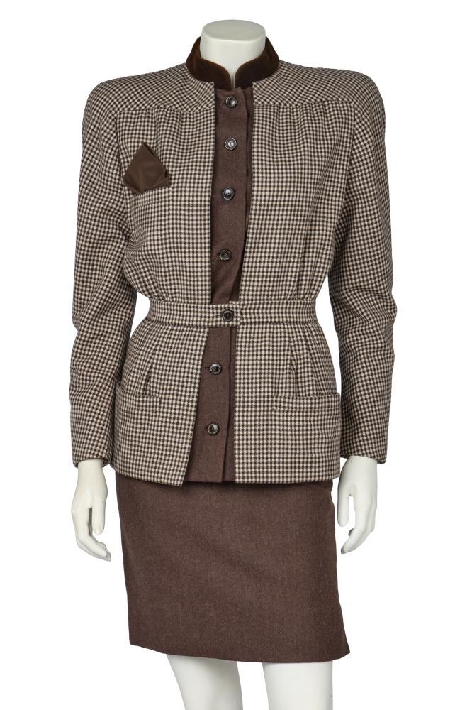 A Valentino Garavani haute couture brown and white checked wool day suit, 1984

A Valentino Garavani haute couture brown and white checked wool day suit, 1984

labelled, the jacket with brown velvet collar, plain brown wool faux blouse insertion to front, silk handkerchief square, bust 91cm 36in; with matching skirt, waist 61cm 24in (2)

Share this lot: