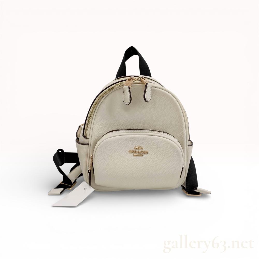 Description
Coach backpack crafted in white pebbled leather featuring a compact rounded rucksack silhouette. Designed with a front zip pocket, double zip main compartment, and adjustable black shoulder straps. Gold-tone Coach logo detail at front with leather zipper pulls.


White pebbled leather exterior


Double zip-around main closure


Front zip pocket with rounded shape


Adjustable black shoulder straps and top handle


Gold-tone Coach logo and hardware accents


Mesh back panel for comfort


Light wear visible to corners and straps consistent with handling. Interior clean with intact structure and functioning zippers.