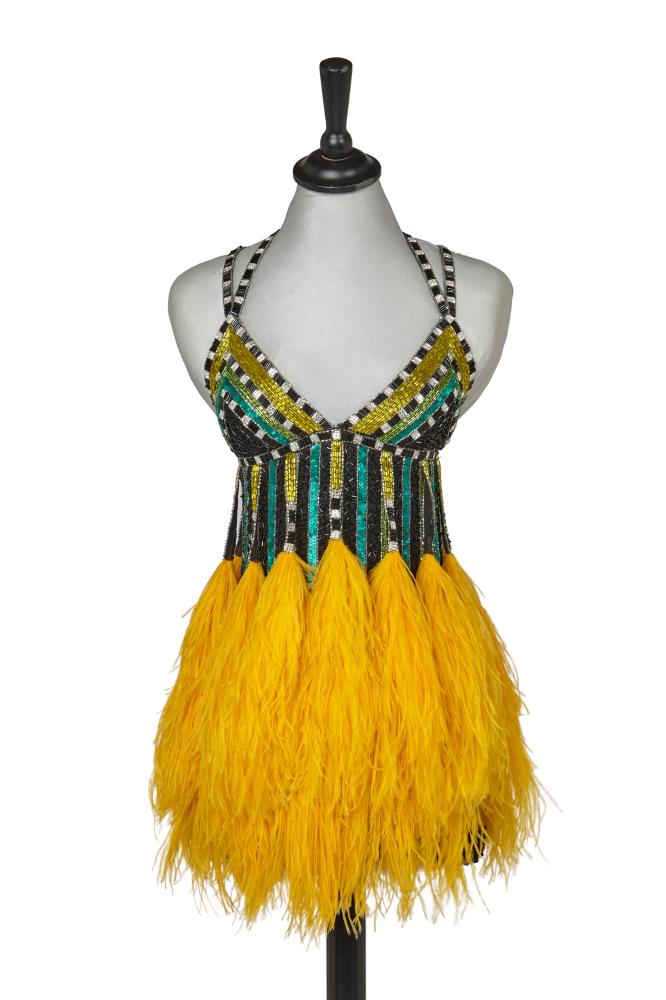 A Bob Mackie beaded and sequinned top, Autumn-Winter 1988-89

A Bob Mackie beaded and sequinned top, Autumn-Winter 1988-89

labelled, size 6, the black voile ground heavily embellished with sequins, bugle beads and rhinestones forming colourful striped patterns, with self fringes to waist tipped with canary yellow ostrich plumes, bust approx 71cm 28in

Share this lot: