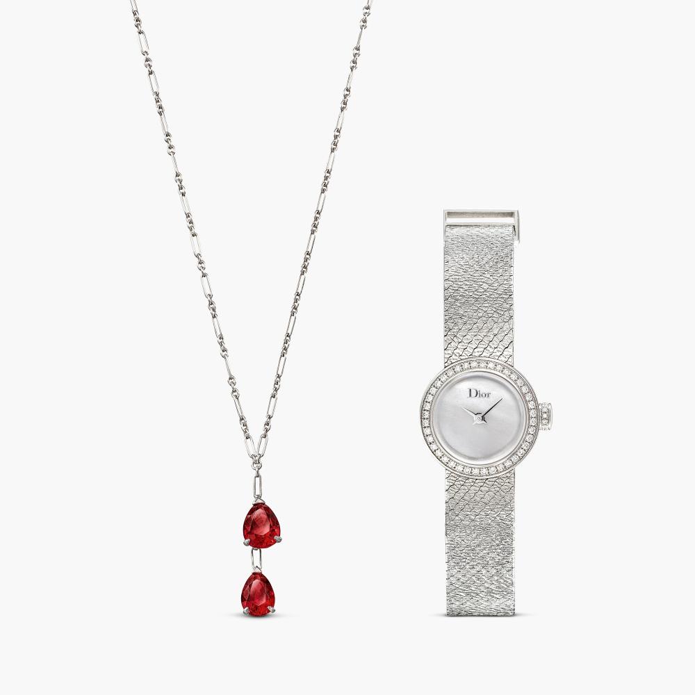 Dior

The pendent necklace suspending two pear-shaped spinels; and a wristwatch with a round dial decorated with brilliant-cut diamonds, completed with a textured stainless steel strap.