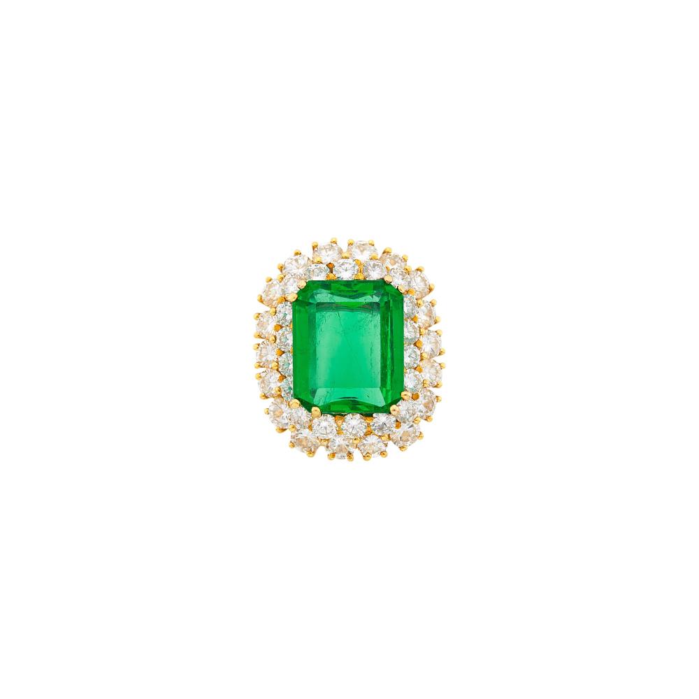 Property of a Beverly Hills SwanOne emerald-cut emerald weighing 8.59 cts., 36 round diamonds ap. 4.15 cts., ap. 8 dwts. Size 6.
 
With AGL report no. 1154524 stating Colombian origin, with gemological evidence of Moderate Modern clarity enhancement.

Tests as 18 kt.Emerald: medium slightly bluish green, slightly included, several small chips/abrasions on table edge, good transparency, shallow pavilion, lively.Diamonds: G-H-VS.Width 1 inch.                            
Any condition statement is given as a courtesy to a client, is an opinion and should not be treated as a statement of fact and our Organization shall have no responsibility for any error or omission. Please contact the specialist department to request further information or additional images that may be available.