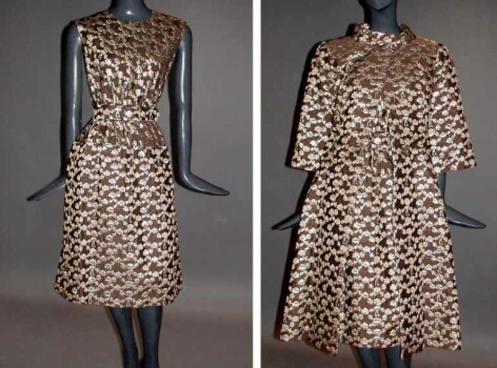 Pauline Trigere Brocade Cocktail Ensemble

Lot 561
Pauline Trigere Brocade Cocktail Ensemble
 American, circa 1965 
 Silver and puce, comprising a sleeveless knee length dress and coat fitted at waist, with full skirt, self belt, size 6, labeled: Pauline Trigere.
Very good condition.