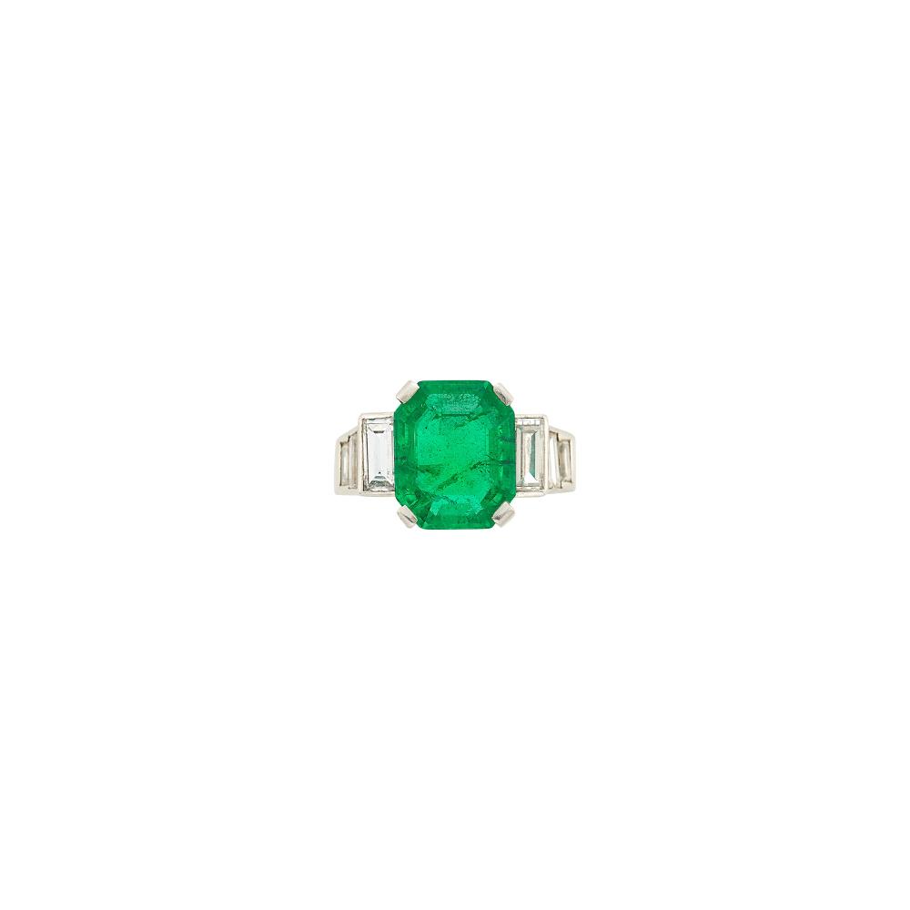 Property of a Prominent CollectorOne cut-cornered emerald-cut emerald weighing 4.41 cts., 10 baguette diamonds ap. 1.80 cts., ap. 6.6 dwts. Size 4 1/4.
 
With AGL report no. 1154129 stating Colombian origin, with gemological evidence of Minor Traditional clarity enhancement.

Emerald: bright medium to medium deep green, moderately included, several small chips on table edge, lively.Diamonds: G-H-I-VS.                            
Any condition statement is given as a courtesy to a client, is an opinion and should not be treated as a statement of fact and our Organization shall have no responsibility for any error or omission. Please contact the specialist department to request further information or additional images that may be available.