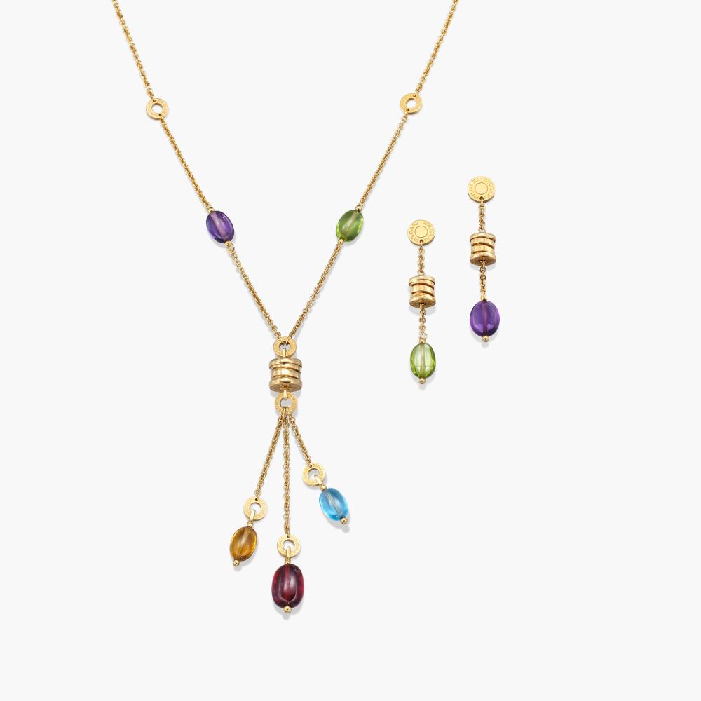Bulgari

Comprising: a necklace of tassel design, set with amethyst, peridot, blue topaz, citrine and garnet beads; a pair of earrings en suite.