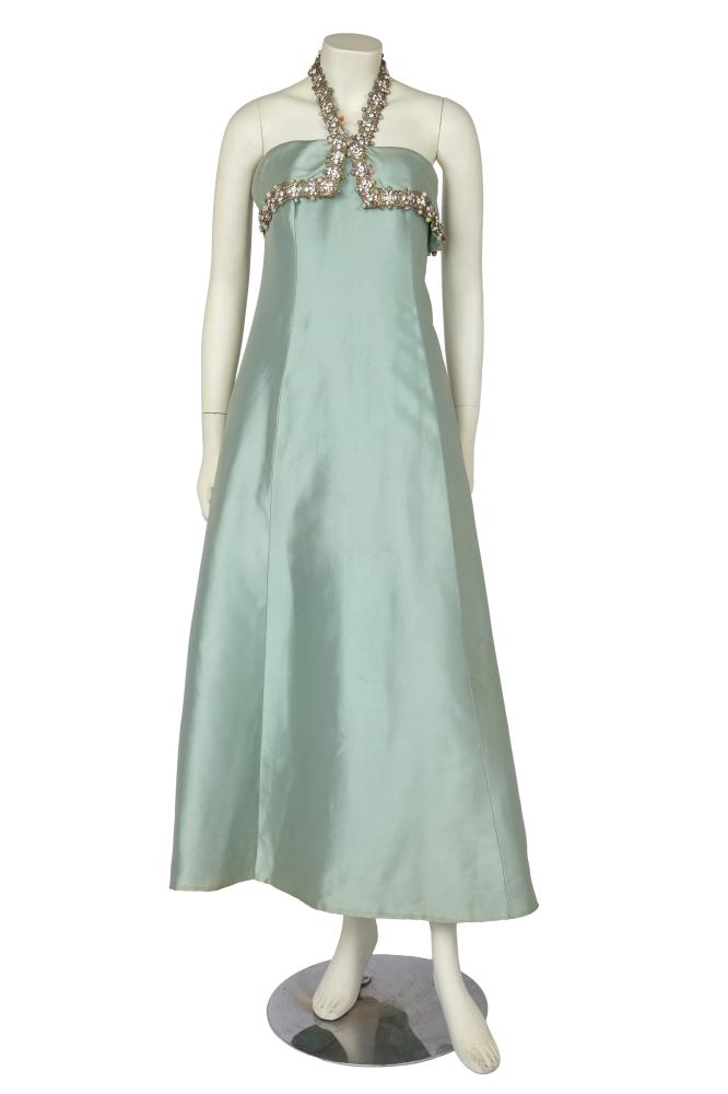 A Jacques Heim haute couture blue zibeline evening gown, circa 1960

A Jacques Heim haute couture blue zibeline evening gown, circa 1960

labelled, princess-line, the halter-neck strap and top bodice band adorned with silver braid, pastel beads and rhinestones, bust approx 86cm 34in

Share this lot: