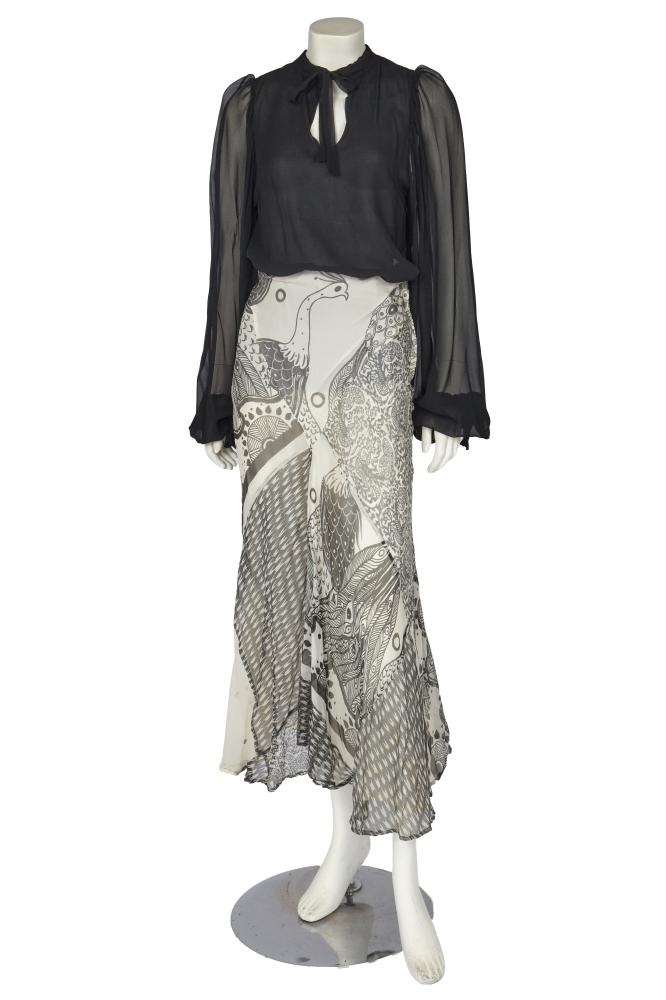 A Thea Porter black chiffon blouse and two chiffon skirts, circa 1971

A Thea Porter black chiffon blouse and two chiffon skirts, circa 1971

labelled, the plain black blouse with full sleeves, ties to neck and cuffs, bust approx 86cm 34in; one skirt with Sandra Munro black and white peacock print, waist 66cm 26in; the other formed from black and white panels of Michael Zeld Indian and Persian-inspired foliate and paisley designs, with asymmetric black chiffon flounces, waist 61cm 24in (3)

Provenance: the late Lola Yearwood collection

Share this lot: