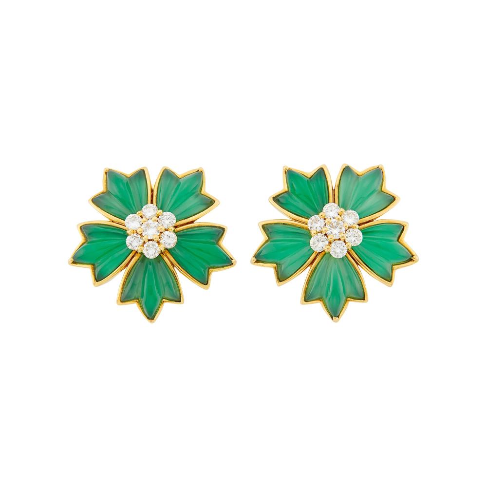 The Martin and Lynn Halbfinger Collection18 kt., 10 carved green onyx petals, 14 round diamonds ap. 1.25 cts., signed VCA, Made in France, no. NY 3K768-2, with maker’s marks and French assay marks, ap. 14.3 dwts. gross.

Green onyx: medium very slightly bluish-green, translucent, very good polish.Diamonds: F-G-VSClip-backs. 1 x 1 1/16 inches.                            
Any condition statement is given as a courtesy to a client, is an opinion and should not be treated as a statement of fact and our Organization shall have no responsibility for any error or omission. Please contact the specialist department to request further information or additional images that may be available.