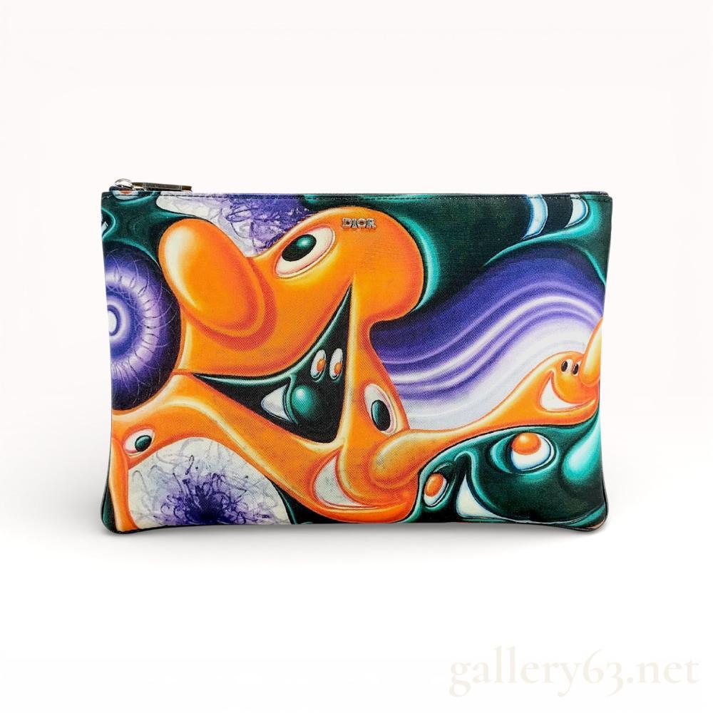 Description
Christian Dior Kenny Scharf Multicolor Printed Nylon Invitation Travel Pouch with silver hardware from the 2020 collection