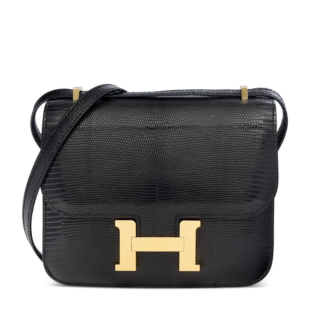 A SHINY BLACK SALVATOR LIZARD MINI CONSTANCE MIRROR WITH PALLADIUM HARDWARE

HERMÈS, 2023

GRADE: 2 
18 w x 15 h x 5 d cm 
includes felt protector, dustbag and box  
Varanus Salvator, Annexe CITES II-B 
“This lot is subject to CITES export/import restrictions. The lot can only be shipped within the European Union or personally picked up from our Paris saleroom. We apologize in advance if we are unable to deliver the lot to the shipping address that you specified at registration. Please refer to the “Conditions of Sale” or contact the department for further details.”