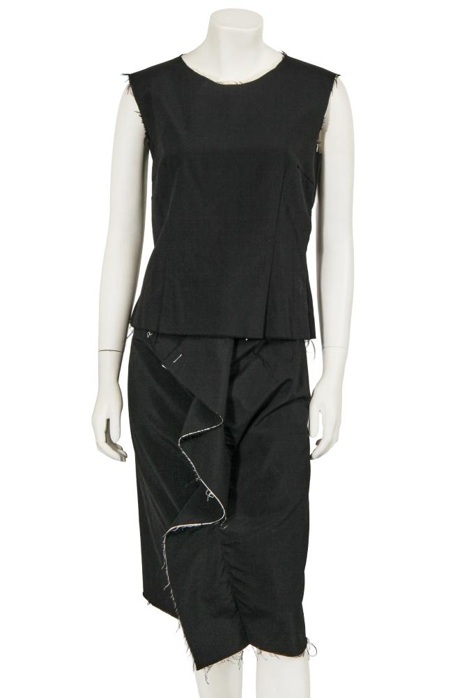 A Comme des Garçons black wool ensemble, ‘Clustering Beauty’ collection, Spring-Summer 1998

A Comme des Garçons black wool ensemble, ‘Clustering Beauty’ collection, Spring-Summer 1998

gold on black woven label, size S, the sleeveless bodice with frayed edges revealing the cotton lining layer below, bust 91cm 36in; the matching midi skirt formed with excess fabric falling as a flounce to front, waist 71cm 28in (2)

Share this lot: