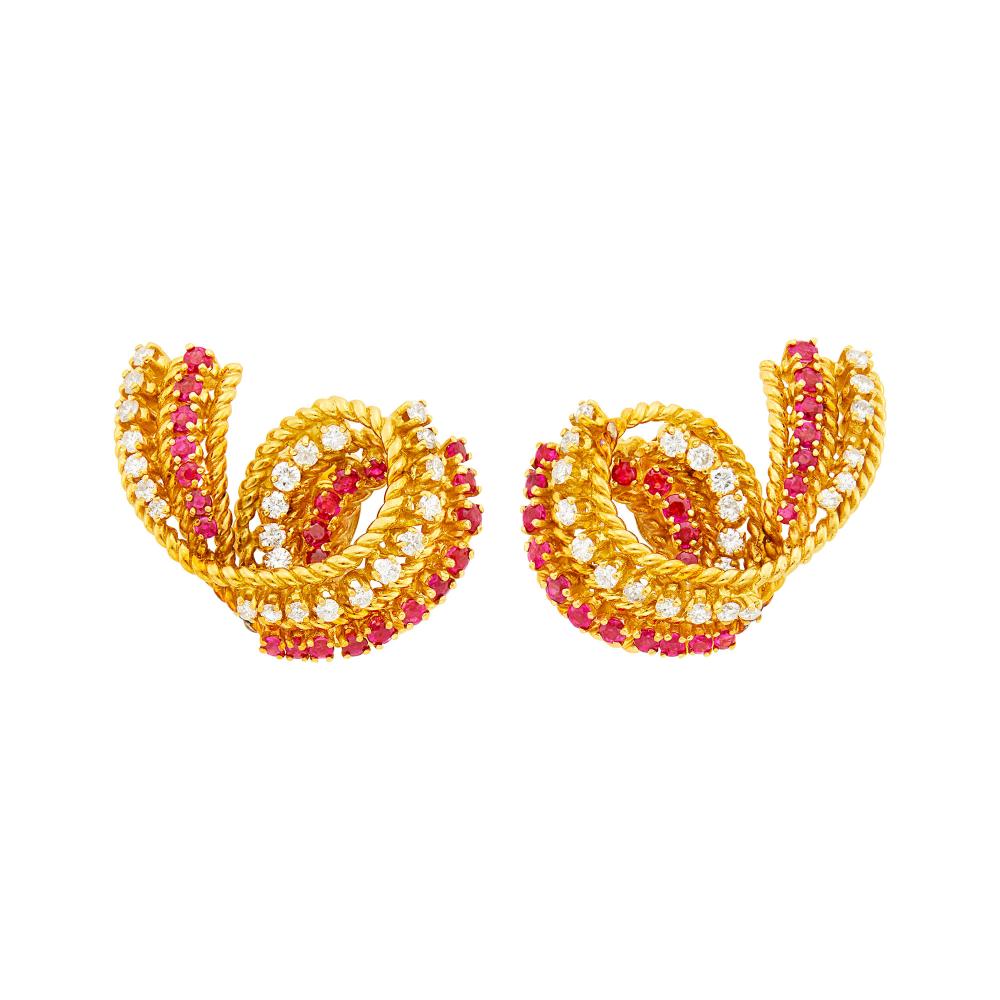 Private Palm Beach Collection18 kt., 48 round diamonds ap. 1.20 cts., signed Tiffany & Co., one diamond missing, ap. 14.7 dwts.

Diamonds: H-I-VS, one diamond missing.Rubies: bright medium deep pinkish red, slightly to several moderately included, lively.Clip-backs. 1 1/4 x 13/16 inches.                            
Any condition statement is given as a courtesy to a client, is an opinion and should not be treated as a statement of fact and our Organization shall have no responsibility for any error or omission. Please contact the specialist department to request further information or additional images that may be available.