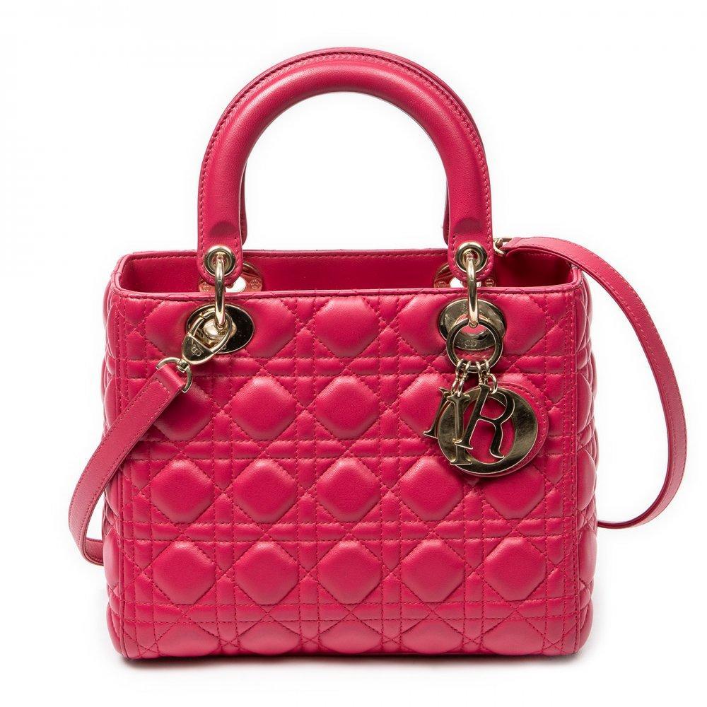 Description

DIOR.
Medium Lady Dior Zip bag.
Fuchsia pink leather, with iconic "cannage" stitching. Gold hardware. D.I.O.R. Charms. Double short top handle. Long removable shoulder strap. Zipper closure.
Includes removable handle, card, brochure and charm.
With interior numbering.
In excellent condition, light signs of use.
Measurements: 24 x 20 x 11 cm.

The Lady Dior is undoubtedly one of the most emblematic bags in the history of fashion. Launched in 1994 under the original name "Chouchou", its destiny changed in 1995. It was then that Bernadette Chirac, First Lady of France, gave it as a gift to Princess Diana of Wales during her visit to Paris. Diana Spencer’s love affair with the bag was instantaneous; from that moment on, the princess wore it assiduously on her travels around the world, consolidating its popularity. Given the resounding success of the bag when it arrived in boutiques in January 1996, the Maison decided to officially rename it Lady Dior, an enduring tribute to the iconic Princess of Wales. This coveted accessory comes in a wide variety of materials, ranging from soft lambskin or patent calfskin, to more exotic options such as deerskin, smooth leather, grained leather, crocodile skin, canvas or python skin, among others. Each Lady Dior piece is a handcrafted work of art, requiring the meticulous work of seven craftsmen and a minimum of eight hours of manufacturing. For its elaboration, about 130 pieces must be delicately cut and sewn by hand, which underlines its exclusivity and the mastery behind its creation.

Includes removable handle, card, brochure and charm. With interior numbering. In excellent condition, light signs of use.