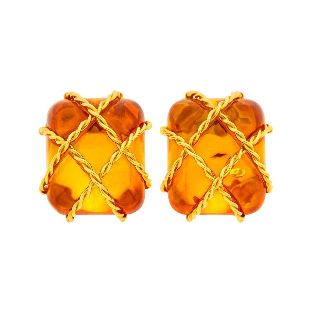 Property from a Prominent Maryland Collection18 kt., 2 cushion-shaped cabochon amber ap. 30.0 x 25.0 mm., backed by gold, signed Seaman Schepps, no. 846, with maker’s mark, ap. 25.4 dwts. gross.

Amber: glowing orange, slightly included, transparent, very good polish.Clip-backs. 1 1/4 x 1 inches.                            
Any condition statement is given as a courtesy to a client, is an opinion and should not be treated as a statement of fact and our Organization shall have no responsibility for any error or omission. Please contact the specialist department to request further information or additional images that may be available.