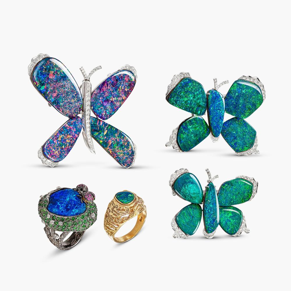 Group of Coloured Stone and Diamond Jewellery | 寶石 配 鑽石 珠寶一組

Three brooches each designed as a butterfly, set with variously shaped black opal plaques, decorated with brilliant-cut diamonds; and a ring set with a cabochon black opal, decorated with circular-cut pink sapphire and tsavorite garnets, accented by brilliant-cut diamonds; also a ring set with a black opal plaque, highlighted with brilliant-cut diamonds.