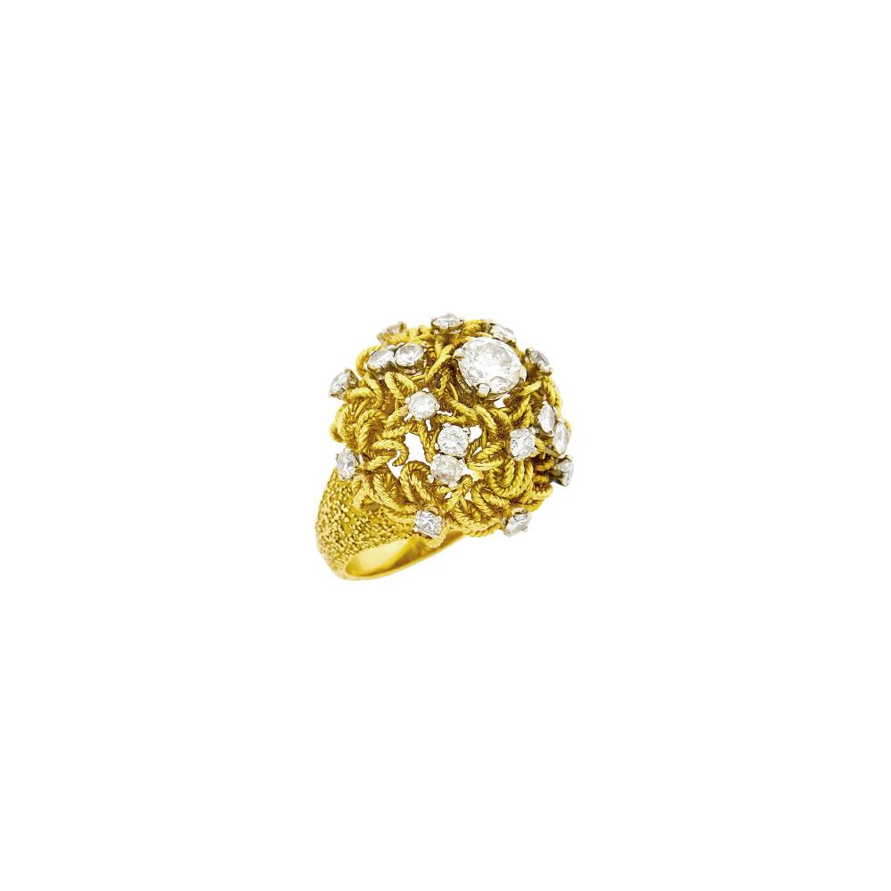 Property of a Distinguished Lady from Athens, Greece18 kt., one round diamond ap. .55 ct., 20 round diamonds ap. 1.40 cts., signed VCA, Made in France, ’66’, nos. obscured, ap. 9 dwts. Size 5 1/2.

Diamons: G-H-I-VS.Width 3/4 inch. Height ap. 1/2 inch.                            
Any condition statement is given as a courtesy to a client, is an opinion and should not be treated as a statement of fact and our Organization shall have no responsibility for any error or omission. Please contact the specialist department to request further information or additional images that may be available.