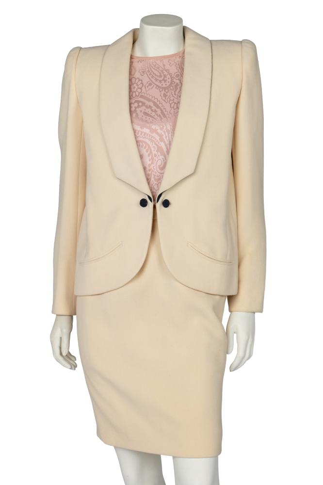 A Valentino Garavani haute couture ivory wool crêpe suit, 1985

A Valentino Garavani haute couture ivory wool crêpe suit, 1985

labelled, the jacket with low angular lapels, dark blue cord-wrapped ’cufflink’ style buttons, chest 97cm 38in; matching skirt, waist 61cm, 24in; and a pink damask silk blouse, bust 97cm 38in (3)

Share this lot: