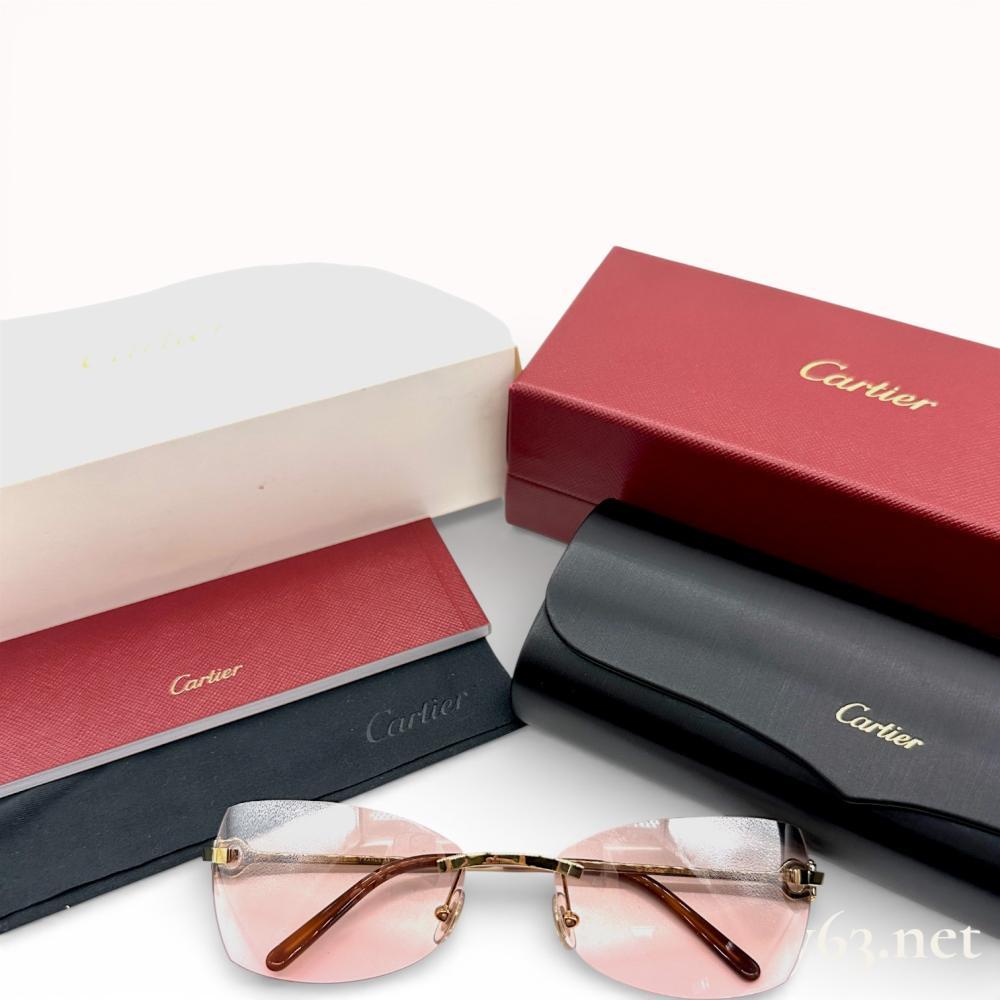Description
Cartier C Decor rimless sunglasses, contemporary, manufactured in France. The design features gold-toned metal hardware with signature C-shaped hinges, rectangular gradient brownish-pink lenses, and translucent brown acetate temple tips. Stamped marks include a serial number and 18 on the bridge, 130 MADE IN FRANCE CE on the right interior temple, and Cartier PARIS 130 on the left interior temple. Included accessories consist of the original red outer box, black hardshell case, cleaning cloth, and instructional booklet.