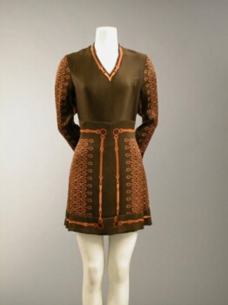 Italian Silk Dress

Lot 550
Italian Silk Dress
 Attributed to Gucci, 1960s 
 Chocolate brown, of harness and buckle design, size 4-6. 
Good condition, slight pulling of fabric at left arm.