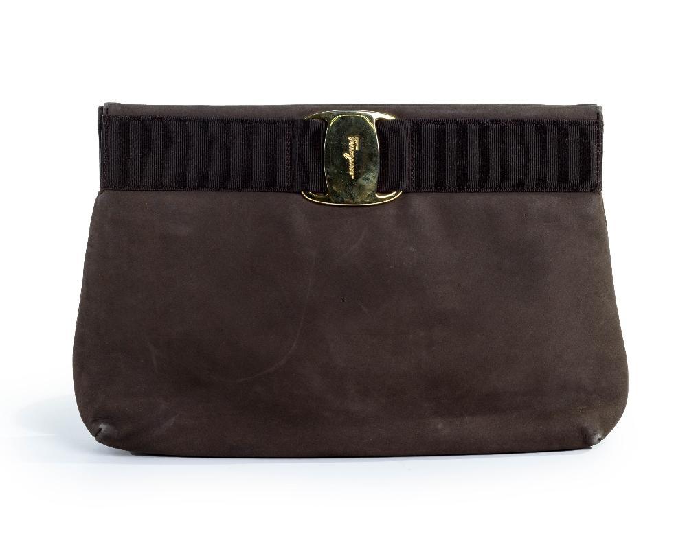 Description
Salvatore Ferragamo.

Shoulder bag, of brown suede leather exterior and canvas interior, with gold-toned brass logo plate, detailed with a non-adjustable strap, comes with the bag only

Width x Height x Depth: 27 x 18 x 6.5 cm

Grade B

Provenance: The Casandra Collection